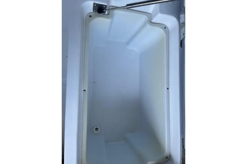 Slide: The Image of Interior view of 2022 Cobalt R8 Outboard boat storage compartment. - 17
