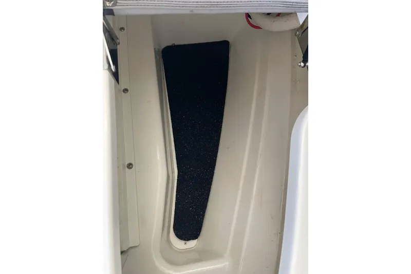 Slide: The Image of 2022 Cobalt R8 Outboard boat interior bathroom with sink and toilet. - 18