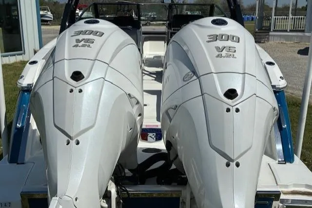 Slide: The Image of 2022 Cobalt R8 Outboard boat interior with blue canopy and modern dashboard. - 4