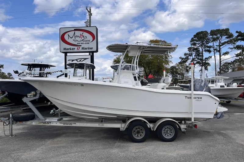 The Image of 2012 Tidewater 216 CC Adventure boat on trailer at Marker 17 Marine dealership. - 1