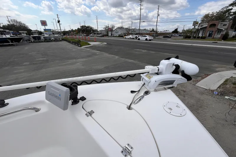 Slide: The Image of Tidewater 216 CC Adventure boat with Garmin equipment, parked near a road, 2012 model. - 11