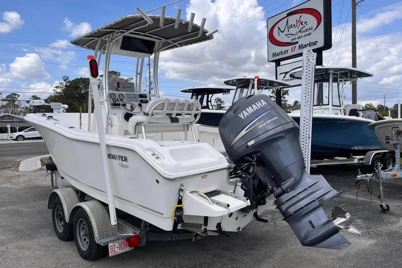 Slide: The Image of 2012 Tidewater 216 CC Adventure boat with Yamaha engine on trailer at dealership. - 3