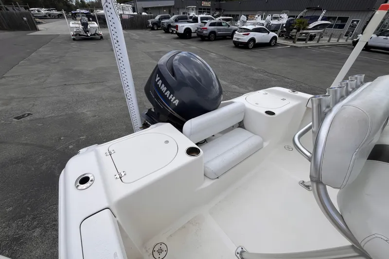 Slide: The Image of 2012 Tidewater 216 CC Adventure boat with Yamaha outboard motor in parking lot. - 6
