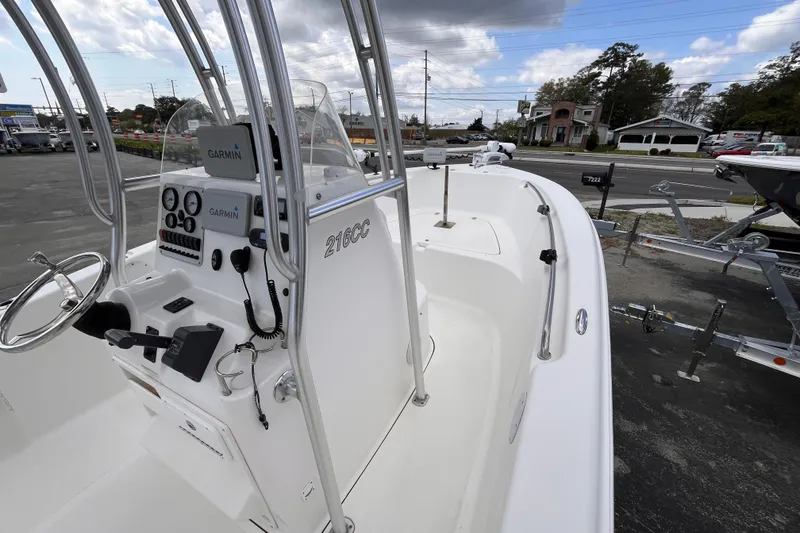 Slide: The Image of 2012 Tidewater 216 CC Adventure boat with Garmin electronics, parked on a trailer. - 9