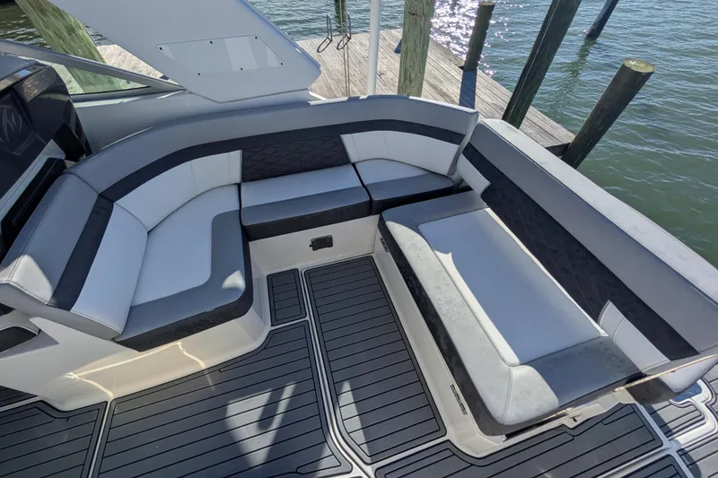 Slide: The Image of 2022 Monterey 295SS Super Sport boat interior with sleek seating and modern design. - 10