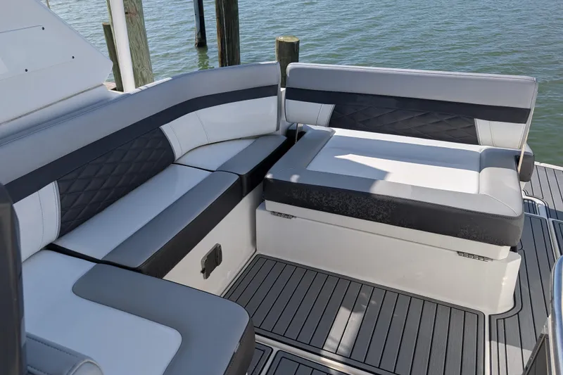 Slide: The Image of Luxurious seating on 2022 Monterey 295SS Super Sport boat, featuring sleek design and comfortable upholstery. - 11