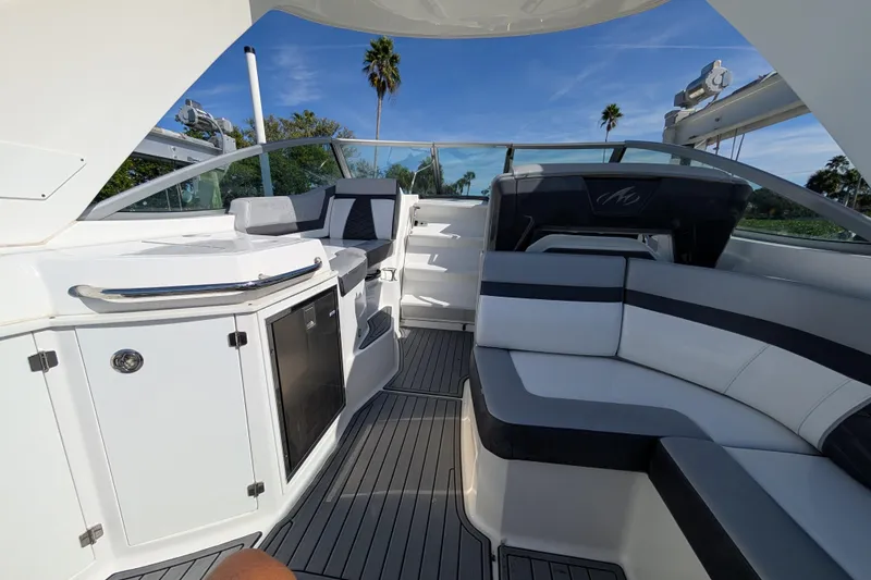 Slide: The Image of Interior of 2022 Monterey 295SS Super Sport boat with sleek seating and modern design. - 13