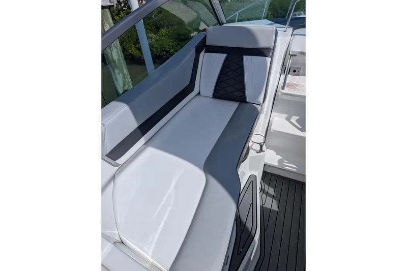 Slide: The Image of 2022 Monterey 295SS Super Sport boat interior with sleek gray seating and modern design. - 14