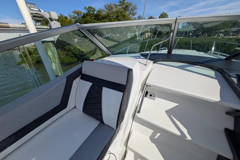 Slide: The Image of 2022 Monterey 295SS Super Sport boat interior with sleek seating and modern design. - 15