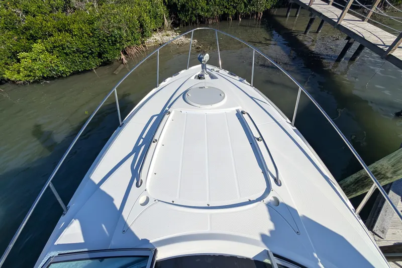 Slide: The Image of Bow view of 2022 Monterey 295SS Super Sport boat docked near mangroves. - 16