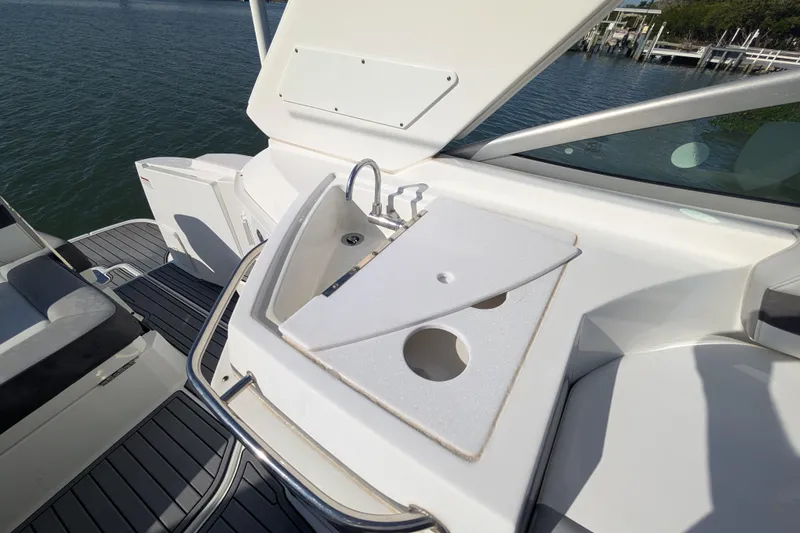 Slide: The Image of 2022 Monterey 295SS Super Sport boat with sink and countertop on deck. - 19