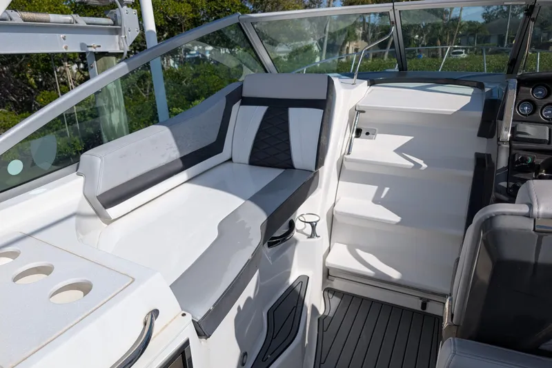 Slide: The Image of 2022 Monterey 295SS Super Sport boat interior with seating and dashboard. - 20