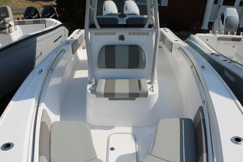 Slide: The Image of Interior view of 2026 Cape Horn 24 XS boat with gray seating. - 13