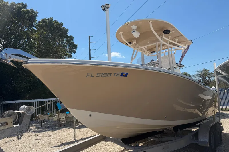 The Image of 2022 Sea Chaser 22 HFC boat on trailer, beige hull, sunny day. - 1