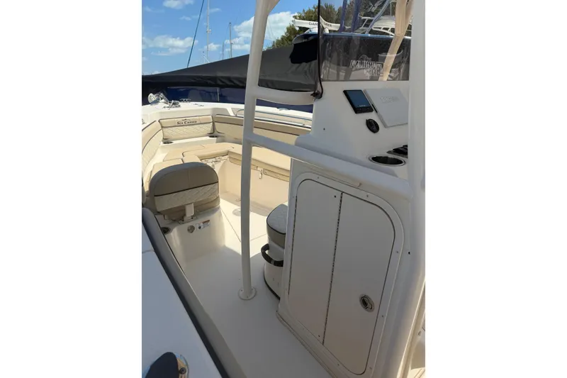 Slide: The Image of 2022 Sea Chaser 22 HFC boat interior with seating and control panel. - 10