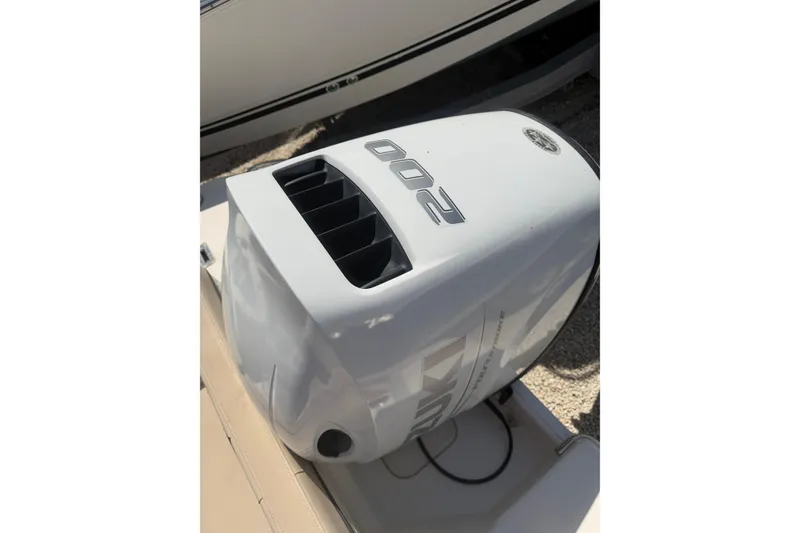 Slide: The Image of Outboard motor on a 2022 Sea Chaser 22 HFC boat, featuring Suzuki branding. - 6