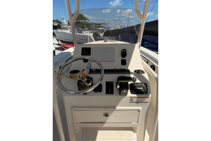 Slide: The Image of 2022 Sea Chaser 22 HFC boat console with steering wheel and controls. - 8