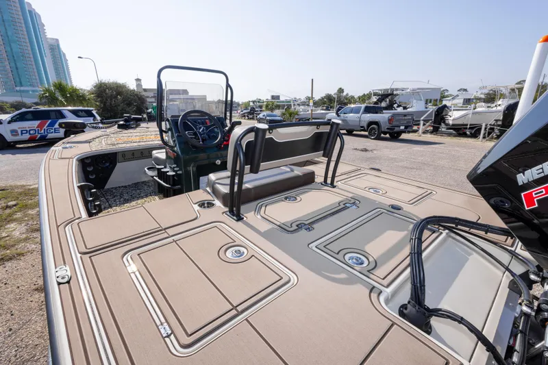 Slide: The Image of 2025 Mako 18 Pro Skiff Backwater Edition boat in a marina setting. - 14