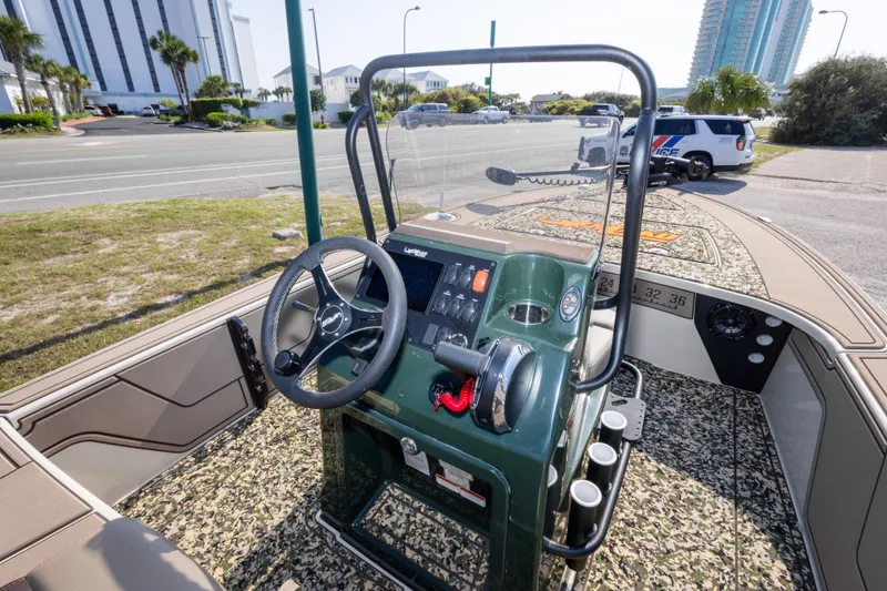 Slide: The Image of 2025 Mako 18 Pro Skiff Backwater Edition boat interior with steering console and controls. - 20