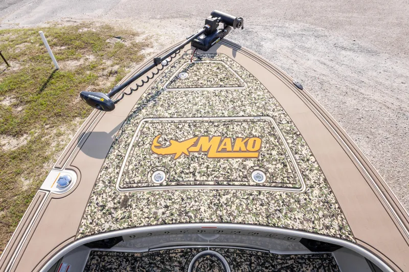 Slide: The Image of 2025 Mako 18 Pro Skiff Backwater Edition with camouflage deck and trolling motor. - 25