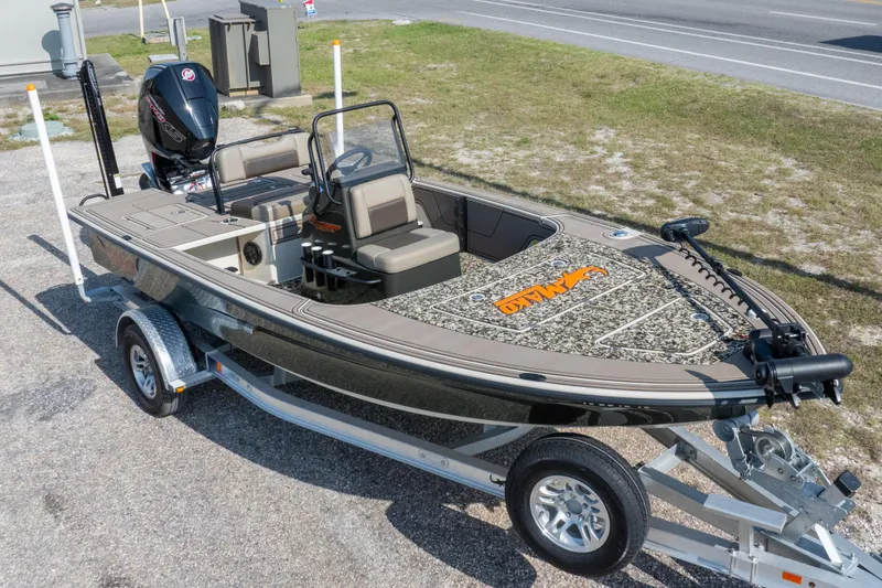 Slide: The Image of 2025 Mako 18 Pro Skiff Backwater Edition boat on trailer, featuring camouflage design. - 29