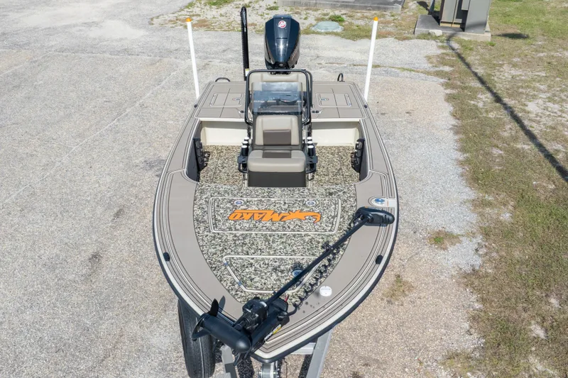 Slide: The Image of 2025 Mako 18 Pro Skiff Backwater Edition boat with camouflage deck and motor. - 36