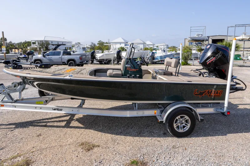 Slide: The Image of 2025 Mako 18 Pro Skiff Backwater Edition on trailer, parked outdoors. - 8