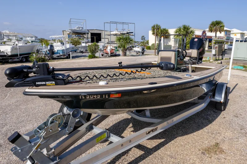 Slide: The Image of 2025 Mako 18 Pro Skiff Backwater Edition boat on trailer, featuring Minn Kota Terrova motor. - 9