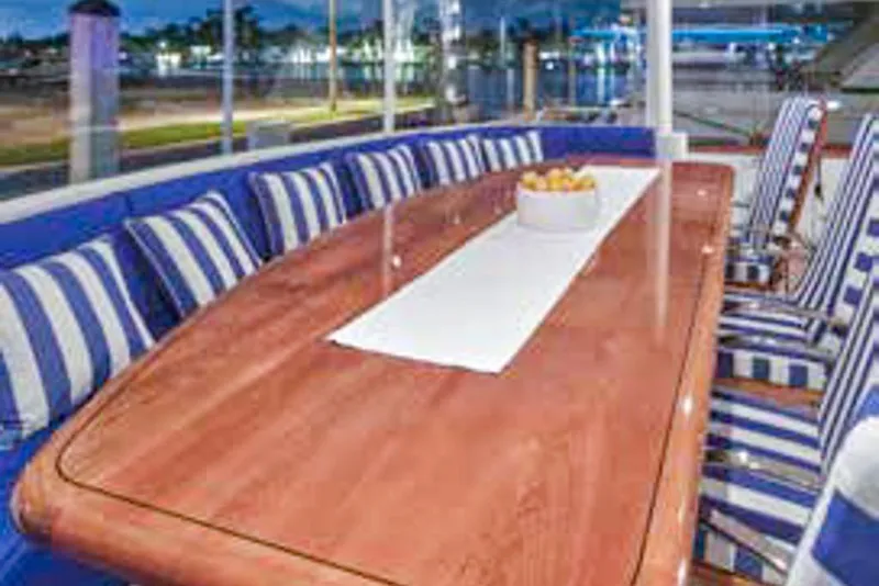 Slide: The Image of Luxurious 2000 Crescent Custom Yacht on serene water at sunset. - 1