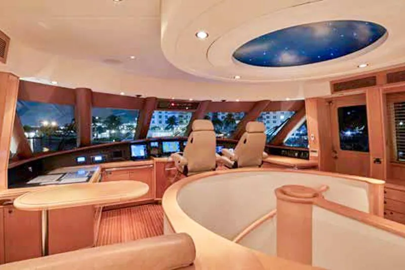 Slide: The Image of Luxurious yacht interior with elegant staircase and compass-themed floor design, Crescent Custom Yachts 2000. - 13