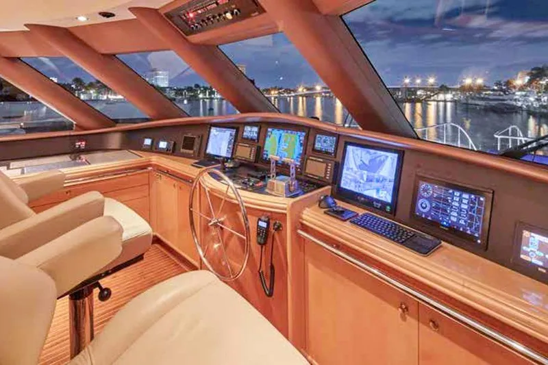 Slide: The Image of Luxurious Crescent Custom Yachts bedroom interior, featuring elegant wood finishes and cozy bedding. - 14