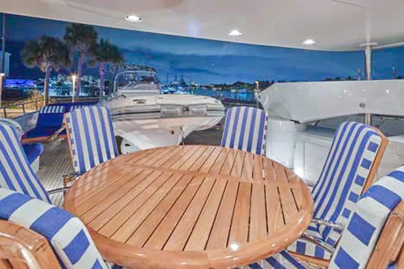 Slide: The Image of Luxurious bedroom interior on 2000 Crescent Custom Yacht, featuring elegant wood cabinetry and plush bedding. - 15