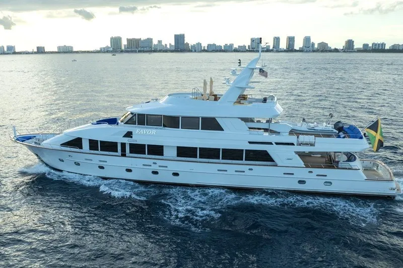 Slide: The Image of Luxurious 2000 Crescent Custom Yacht cruising near city skyline on open water. - 31