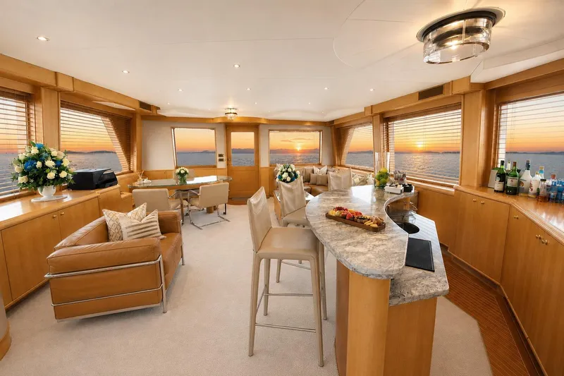 Slide: The Image of Luxurious Crescent Custom Yacht interior with elegant furnishings and ocean sunset view, 2000 model. - 36