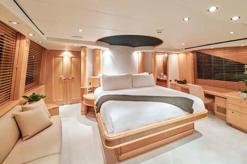 Slide: The Image of Luxurious dining area in a 2000 Crescent Custom Yacht with elegant wood finishes and modern lighting. - 4