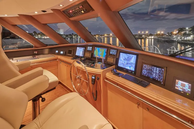 Slide: The Image of Luxurious Crescent Custom Yachts helm, 2000 model, with advanced navigation systems at night. - 40