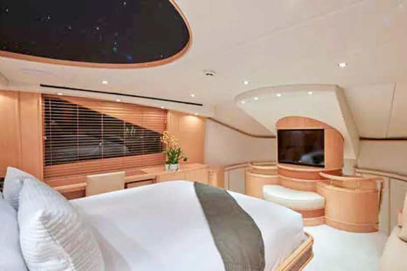 Slide: The Image of Luxurious yacht bathroom with tropical leaf wallpaper, black countertop, and elegant fixtures, Crescent Custom Yachts 2000. - 5