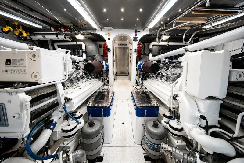 Slide: The Image of Engine room of a 2000 Crescent Custom Yacht, featuring dual MTU engines. - 51