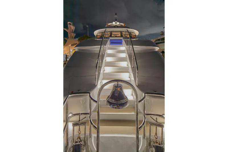 Slide: The Image of Luxurious 2000 Crescent Custom Yacht with illuminated stairs at night. - 56