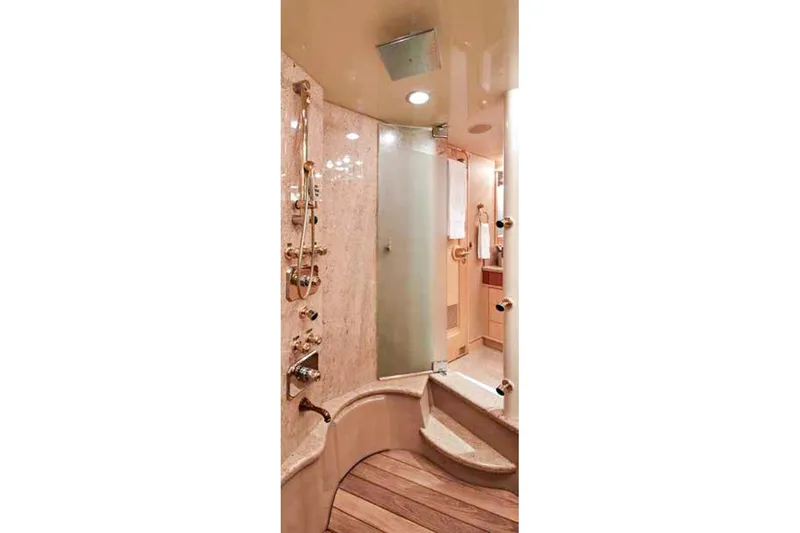 Slide: The Image of Luxurious Crescent Custom Yachts bedroom interior, 2000 model, featuring elegant wood finishes. - 6