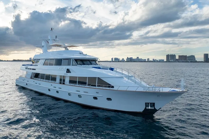 Slide: The Image of Luxurious 2000 Crescent Custom Yacht cruising on open water under cloudy skies. - 60