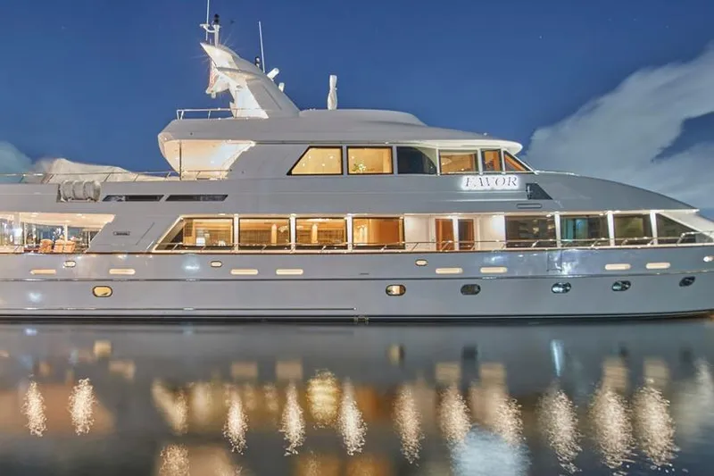 Slide: The Image of Luxurious 2000 Crescent Custom Yacht reflecting on calm water at night. - 61