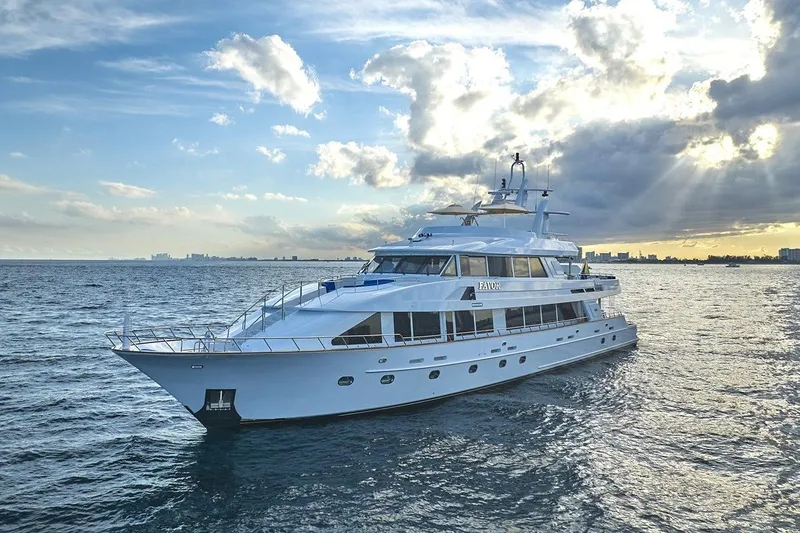 Slide: The Image of Luxurious 2000 Crescent Custom Yacht cruising on open water at sunset. - 62