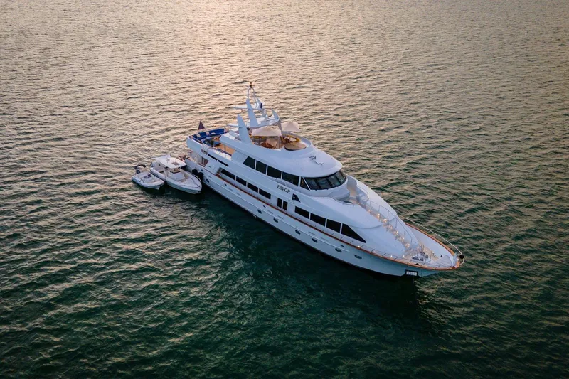 Slide: The Image of Luxurious 2000 Crescent Custom Yacht on serene water at sunset. - 64