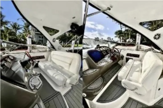 Slide: The Image of 2007 Regal Commodore 3760 IB yacht interior with white seating and modern dashboard. - 13