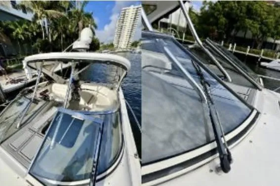 Slide: The Image of 2007 Regal Commodore 3760 IB yacht docked, showcasing sleek design and spacious deck. - 3
