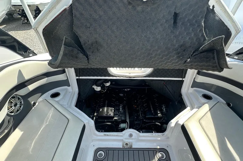 Slide: The Image of Open engine compartment of a 2016 Yamaha 242 Limited S boat. - 13