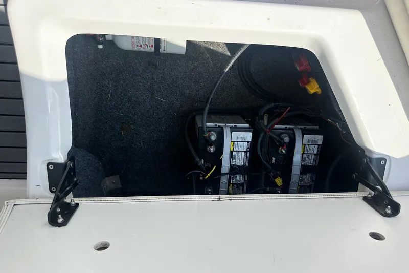 Slide: The Image of Battery compartment of a 2016 Yamaha 242 Limited S boat, showing dual batteries and wiring. - 14