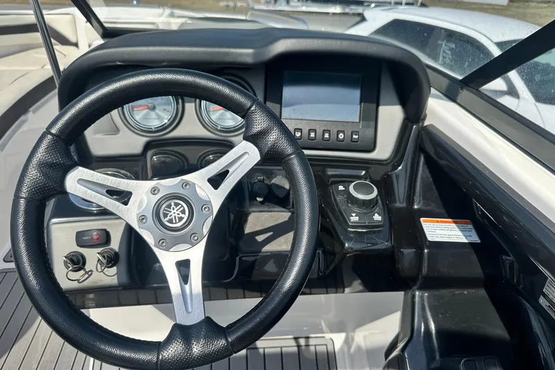 Slide: The Image of Steering wheel and dashboard of 2016 Yamaha 242 Limited S boat. - 19