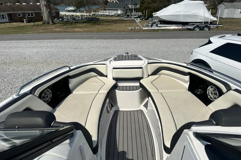 Slide: The Image of 2016 Yamaha 242 Limited S boat interior with spacious seating and sleek design. - 22